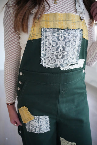 Close-up of the gold bib with a lace patch